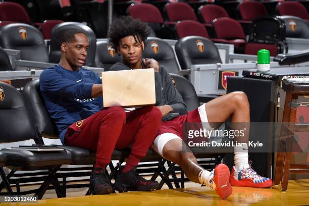 Player Development coach Sam Jones of the Cleveland Cavaliers talks with Kevin Porter Jr. #4 of the Cleveland Cavaliers before the game on February...