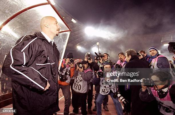 Chelsea manager Gianluca Vialli in the media spotlight during the UEFA Champions League Group D match against Lazio at the Stadio Olimpico in Rome....