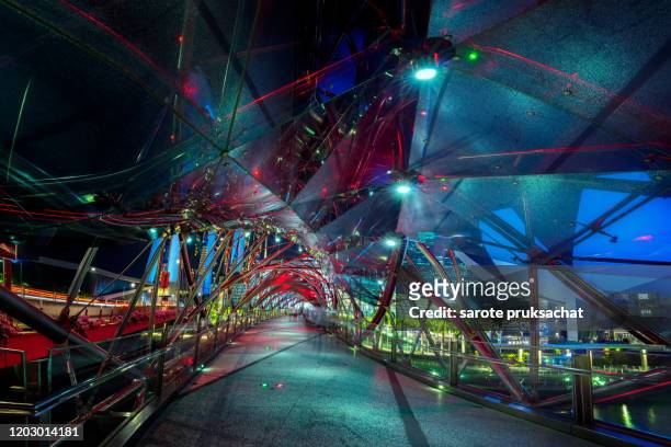 inside the  helix bridge at night in singapore . - contemporary arts center stock pictures, royalty-free photos & images