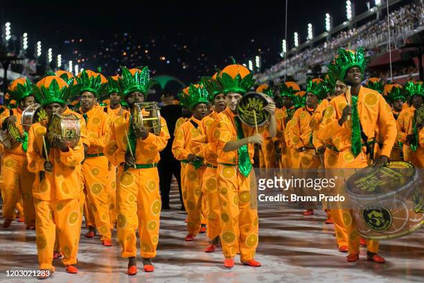 Members of Sao Clemente samba school perform during the second night of 2020 Rio's Carnival Parades at the Sapucai Sambadrome on February 24, 2020 in...