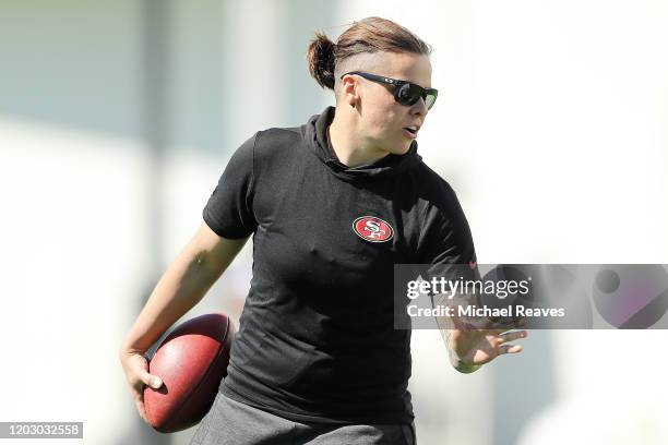 Offensive assistant coach Katie Sowers of the San Francisco 49ers looks on during practice for Super Bowl LIV at the Greentree Practice Fields on the...