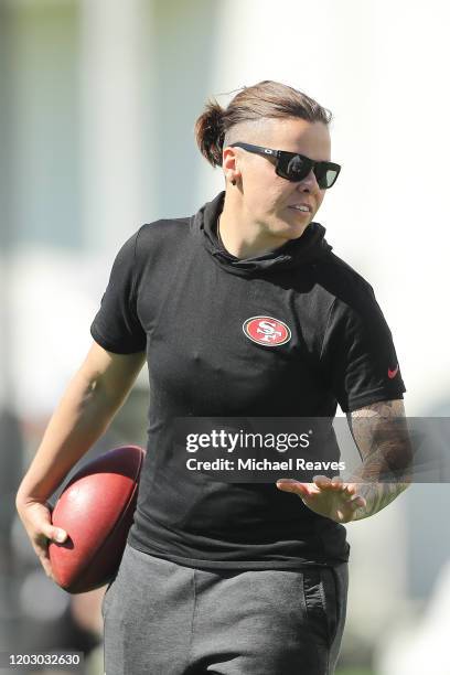 Offensive assistant coach Katie Sowers of the San Francisco 49ers looks on during practice for Super Bowl LIV at the Greentree Practice Fields on the...