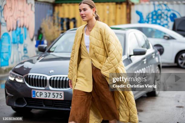 Vera van Erp seen weairng beige coat, brown wild leather cropped pants, blazer outside Rodebjer during Copenhagen Fashion Week Autumn/Winter 2020 Day...