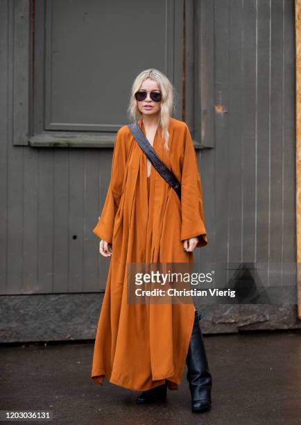 Stephanie Broek seen wearing orange dress outside Rodebjer during Copenhagen Fashion Week Autumn/Winter 2020 Day 3 on January 30, 2020 in Copenhagen,...