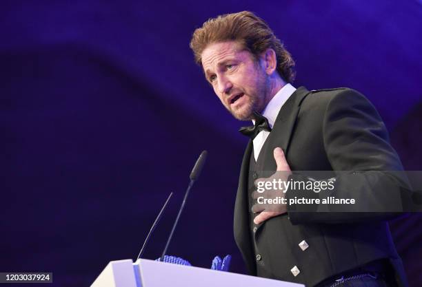 February 2020, Berlin: 70th Berlinale, Cinema for Peace Gala: Actor Gerard Butler. The International Film Festival takes place from 20.02. To ....