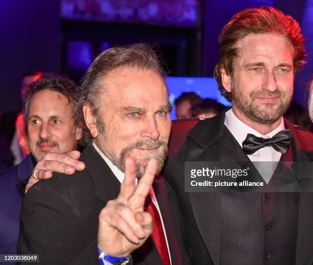 February 2020, Berlin: 70th Berlinale, Cinema for Peace Gala: The actors Franco Nero and Gerard Butler. The International Film Festival takes place...