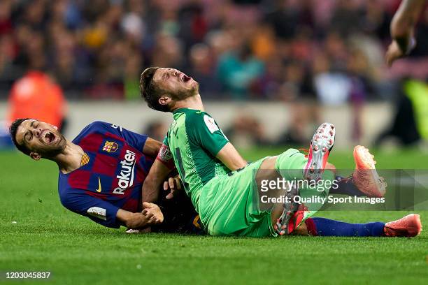 Sergio Busquets of FC Barcelona battles for the ball with Ruben Perez of Leganes during the Copa del Rey round of 16 match between FC Barcelona and...