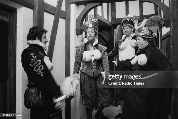 Actors Rowan Atkinson, Hugh Laurie, Roger Blake and William Hootkins in a scene from episode 'Beer' of the BBC television series 'Blackadder II',...
