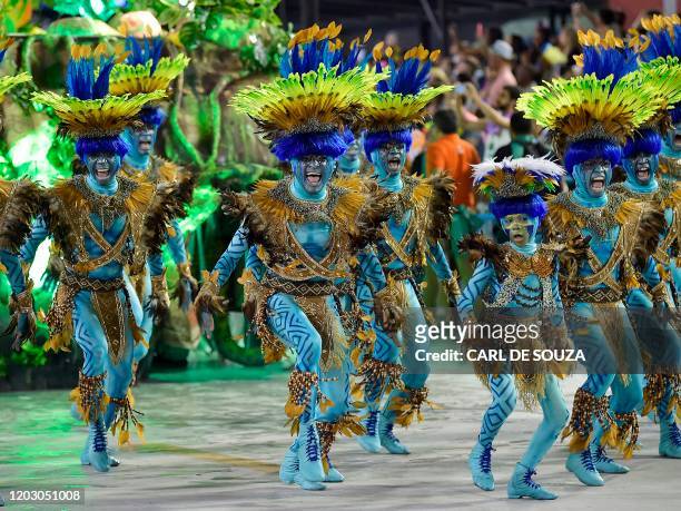 Members of Vila Isabel samba school perform during the last night of Rio's Carnival parade at the Sambadrome Marques de Sapucai in Rio de Janeiro,...