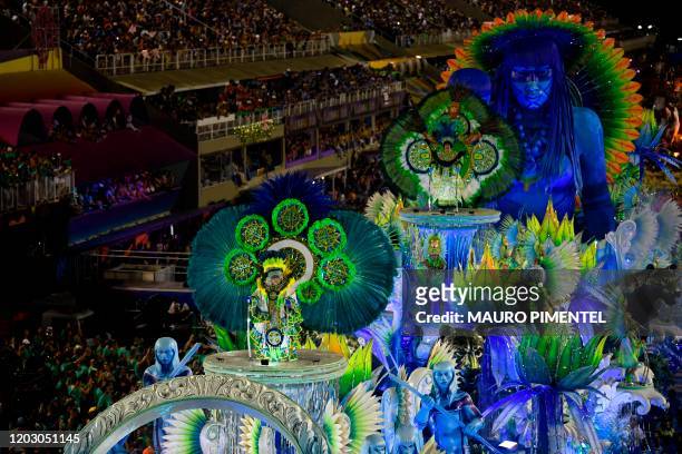 Members of Vila Isabel samba school perform atop a float during the last night of Rio's Carnival parade at the Sambadrome Marques de Sapucai in Rio...
