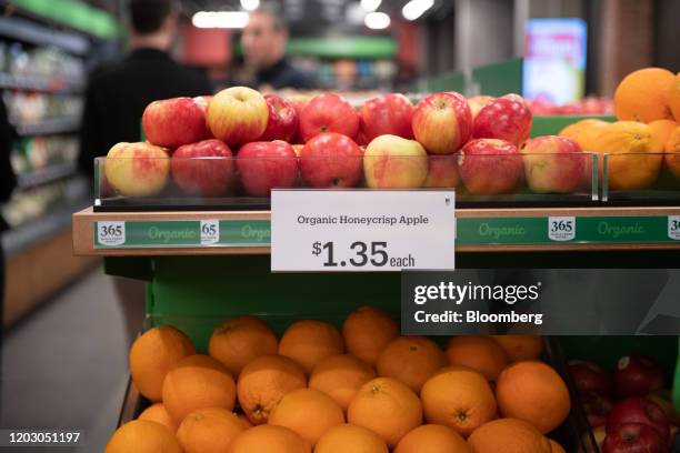 Organic apples sit on a shelf during a tour of a new Amazon Go store in the Capitol Hill neighborhood of Seattle, Washington, U.S., on Monday, Feb....