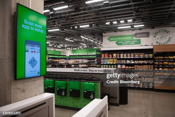 "Scan your app to enter" is displayed on a screen during a tour of a new Amazon Go store in the Capitol Hill neighborhood of Seattle, Washington,...