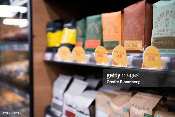 Bags of coffee beans sit on shelves during a tour of a new Amazon Go store in the Capitol Hill neighborhood of Seattle, Washington, U.S., on Monday,...