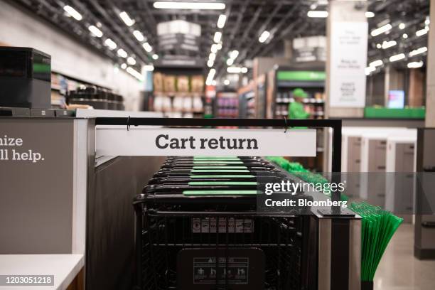 Grocery carts sit in a corral during a tour of a new Amazon Go store in the Capitol Hill neighborhood of Seattle, Washington, U.S., on Monday, Feb....