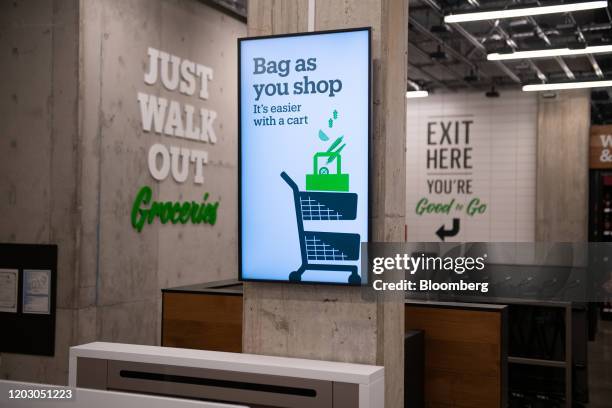 "Bag as you shop" is displayed on a screen during a tour of a new Amazon Go store in the Capitol Hill neighborhood of Seattle, Washington, U.S., on...