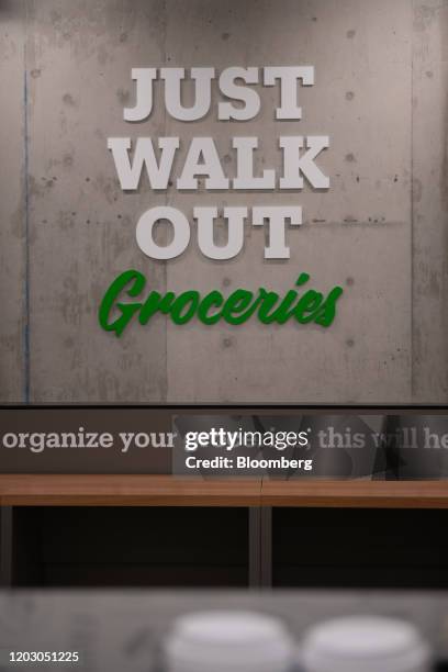 "Just Walk Out" is displayed on a wall during a tour of a new Amazon Go store in the Capitol Hill neighborhood of Seattle, Washington, U.S., on...