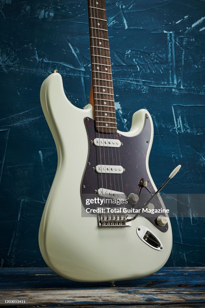 A Squier Classic Vibe 70s Stratocaster electric guitar with an News