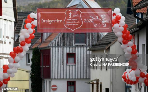 Balloons and a banner with the names of the local carnival triumvirate decorate a street for carnival in Volkmarsen near Kassel, central Germany, on...