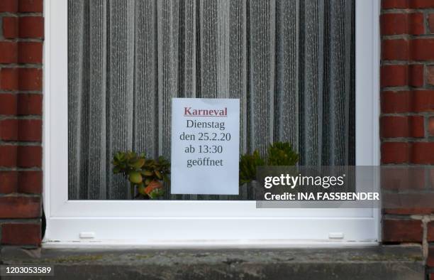 An advice indicates the opening hours of a bar close to the site where a man who drove into a carnival procession, on February 25, 2020 in Volkmarsen...