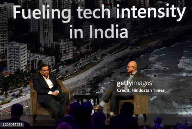 Microsoft CEO Satya Nadella interacts with Mukesh Ambani, Chairman and MD of Reliance Industries, during the Microsoft Future Decoded Summit at St...