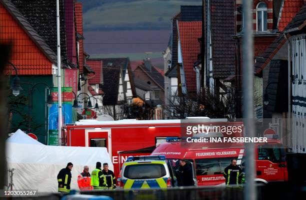 Vehicles of the police and the fire brigades stand at the site where a man who drove into a carnival procession, on February 25, 2020 in Volkmarsen...