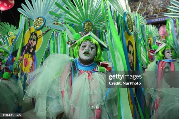 Members of Estacao Primeira de Mangueira samba school perform an act against Rio's violence during the first night of 2020 Rio's Carnival Parades at...