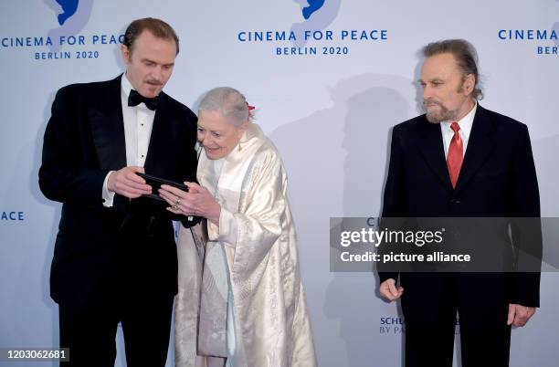 February 2020, Berlin: 70th Berlinale, Cinema for Peace Gala: Carlo Gabriel Nero ,actress Vanessa Redgrave and her husband actor Franco Nero. The...