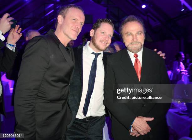 February 2020, Berlin: 70th Berlinale, Cinema for Peace Gala: Producer Christoph Müller, actor Marco Kreuzpaintner and Franco Nero The International...