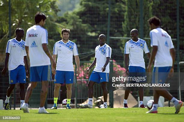 Olympique de Marseille's players Souleymane Diawara and Andre-Pierre Gignac practice during a training session at the Robert Louis-Dreyfus football...