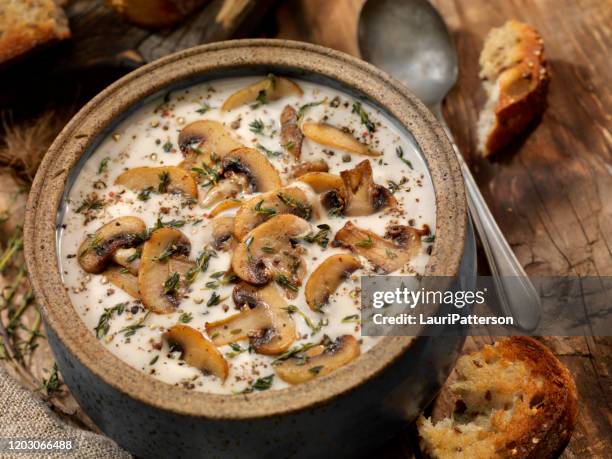 cream of mushroom soup with roasted garlic and thyme - white mushroom stock pictures, royalty-free photos & images