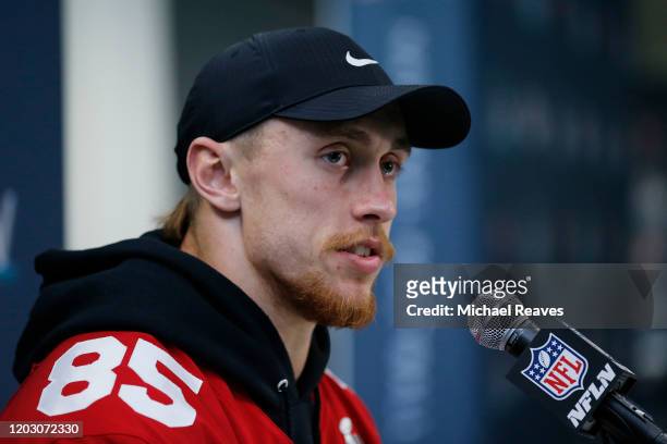 George Kittle of the San Francisco 49ers speaks to the media during the San Francisco 49ers media availability prior to Super Bowl LIV at the James...