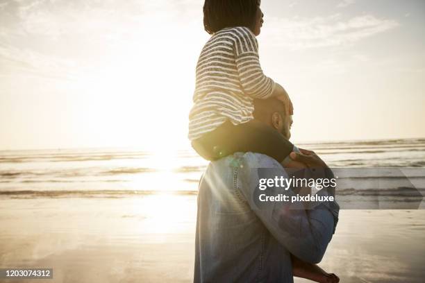 the fun never ends at the beach - carrying on shoulders stock pictures, royalty-free photos & images