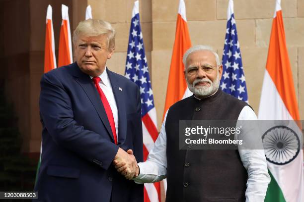 President Donald Trump, left, shakes hand with Narendra Modi, India's prime minister, as they pose for photographers at Hyderabad House in New Delhi,...