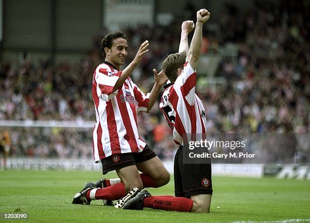 Marian Pahars and Hassan Kachloul of Southampton celebrate the goal during the FA Carling Premiership match against Everton played at the Dell in...