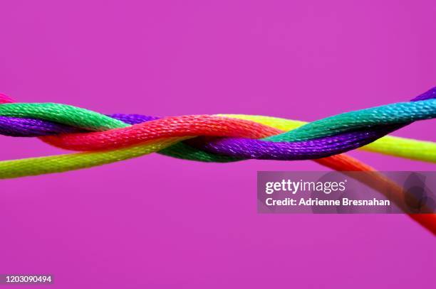 colorful twisting cords - knooppatroon stockfoto's en -beelden