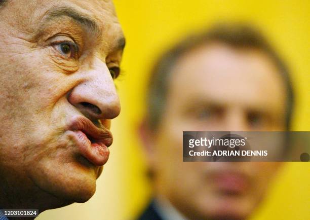 Egyptian President Hosni Mubarak and British prime Minister Tony Blair attend a joint press conference at 10 Downing Street following their meeting...