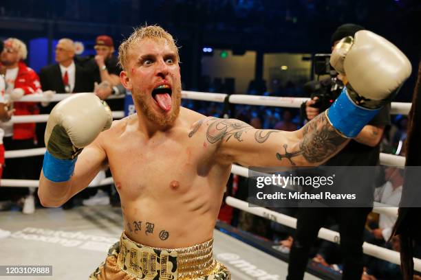 Jake Paul celebrates after defeating AnEsonGib in a first round knockout during their fight at Meridian at Island Gardens on January 30, 2020 in...