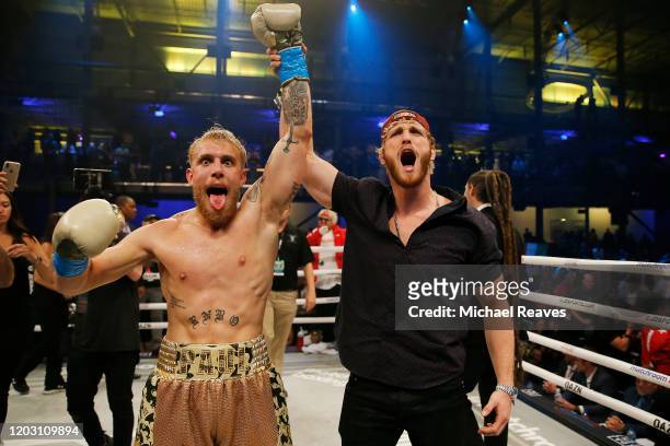 Jake Paul celebrates with his brother, Logan, after defeating AnEsonGib in a first round knockout during their fight at Meridian at Island Gardens on...