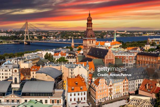 view of old riga at sunset from the st. peter's church, riga, latvia - riga stock-fotos und bilder