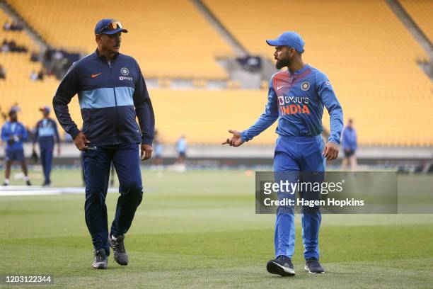 Virat Kohli of India talks to coach Ravi Shastri during game four of the Twenty20 series between New Zealand and India at Sky Stadium on January 31,...