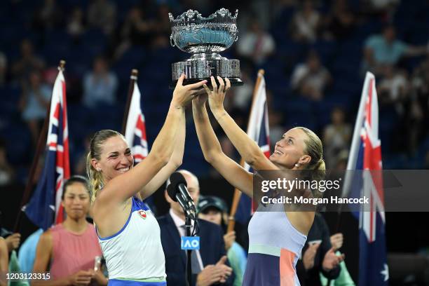 Timea Babos of Hungary and Kristina Mladenovic of France pose with the championship trophy after winning their Women’s Doubles Final match against...