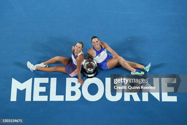 Timea Babos of Hungary and Kristina Mladenovic of France pose with the championship trophy after winning their Women’s Doubles Final match against...