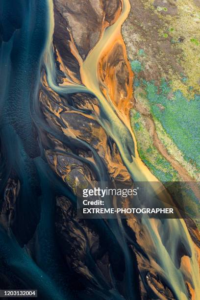 a flowing landscape of icelandic glacial rivers - abstract nature stock pictures, royalty-free photos & images