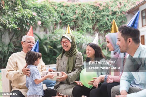 multi generation family birthday - indonesia family stock pictures, royalty-free photos & images