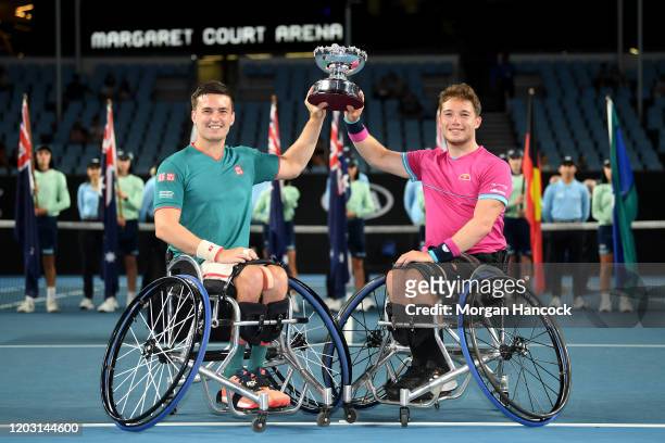 Alfie Hewitt and Gordon Reid of Great Britain pose with the championship trophy after winning their Men's Wheelchair Doubles Final match against...