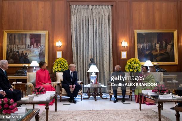 President Donald Trump and First Lady Melania Trump meet India's President Ram Nath Kovind and his wife Savita Kovind during a state banquet at...