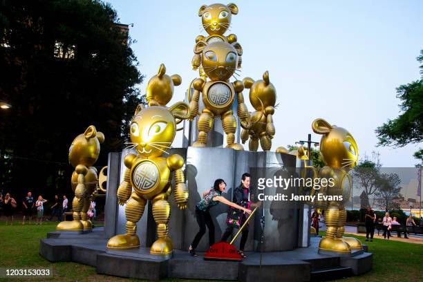 Lord Mayor of Sydney Clover Moore and artist of the rat sculpture, Claudia Chan Shaw pull the switch to light up the rat on January 31, 2020 in...