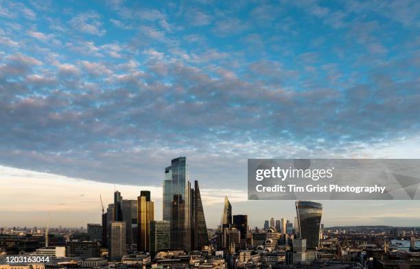 an aerial view of the city of london's financial district skyline - salesforce tower london stock pictures, royalty-free photos & images