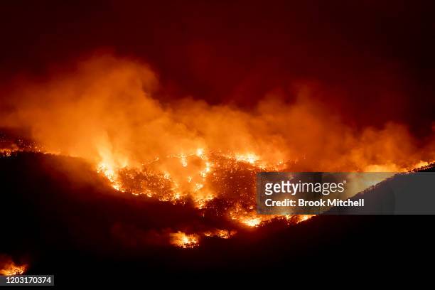 Fire burns within sight of the suburban fringe of the city of Canberra on January 31, 2020 in Canberra, Australia. ACT Chief Minister Andrew Barr...