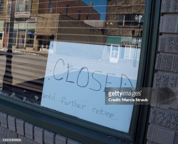 closed until further notice sign in small business window - going out of business stock pictures, royalty-free photos & images